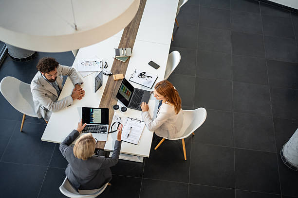 istock Business people working together at the office using laptops 2225094775