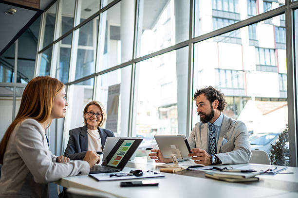 istock Business people having meeting using digital tablet and laptop in modern office 2225094800
