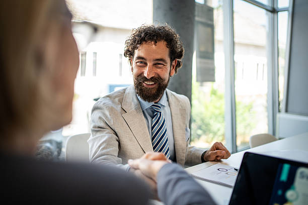 istock Businessman shaking hands with client at office meeting 2225094865