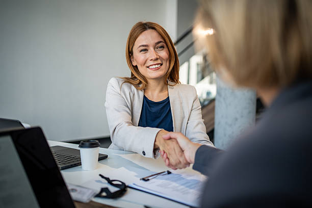 istock Two businesswomen shaking hands after a successful meeting 2225094876