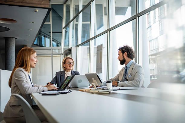 istock Business team working together on project using laptops in modern office 2225094939