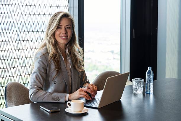 istock A Professional Woman Engaged in Her Work Within a Contemporary Office Environment 2225095592