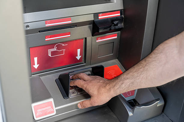 istock Counting and withdrawing Turkish Lira banknotes from an ATM machine 2225095622