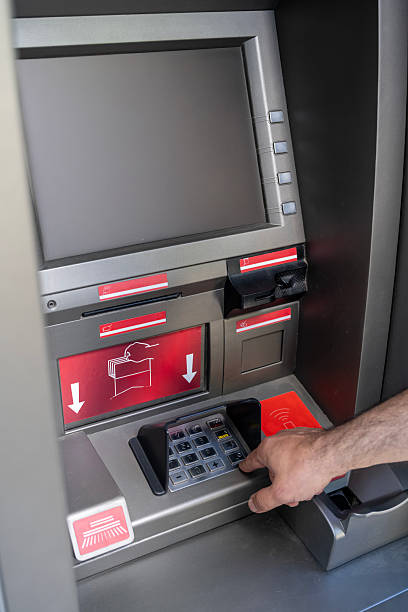Counting and withdrawing Turkish Lira banknotes from an ATM machine