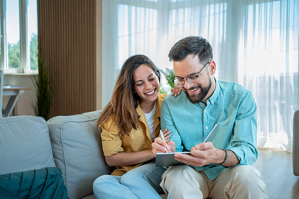 istock Young couple planning finances and budget at home 2225102022