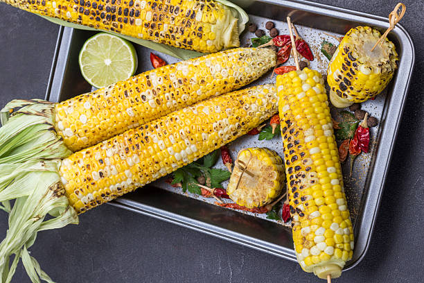 istock Grilled corn and dried red pepper pods on pallet 2225104348