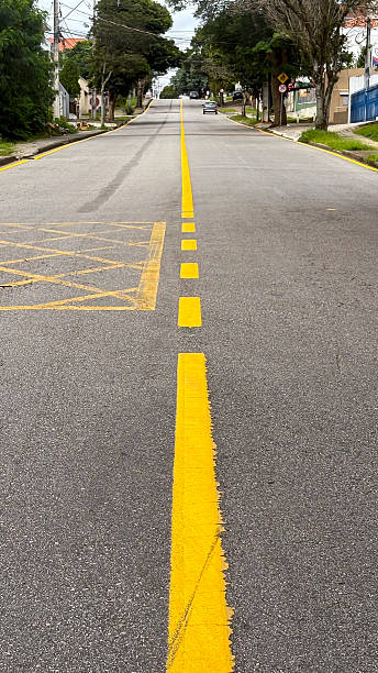 istock Yellow traffic lanes, continuous and interspersed 2225106362