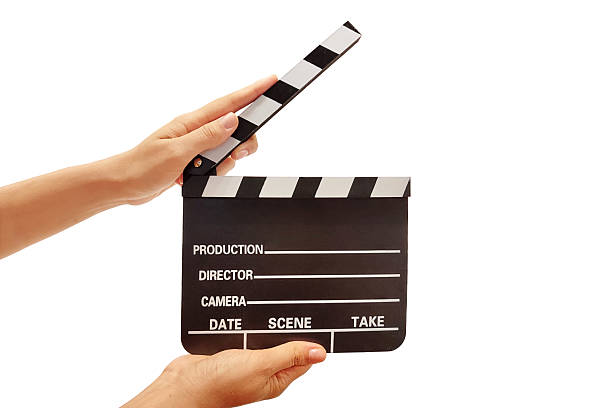 istock Hands holding a movie clapper board on white background 2225106422