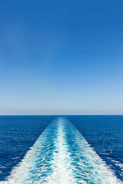 istock Calm ocean waters with a clear blue sky captured from a moving boat, showcasing a serene journey across the sea 2225108128