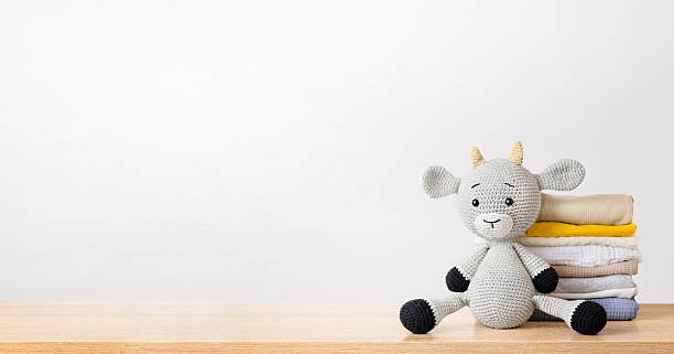 istock knitted toy and clothes on the table 2225108624