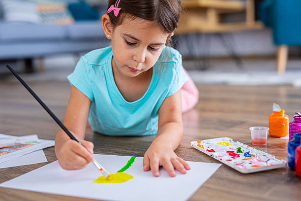 istock Focused young child drawing shapes and patterns at home 2225108907