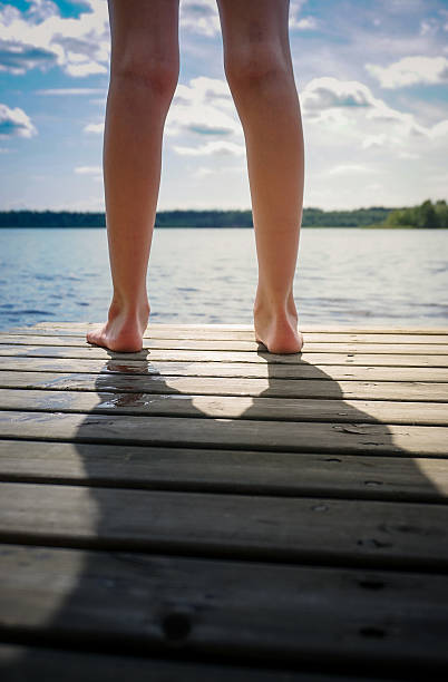 istock Girl at pier 2225109127
