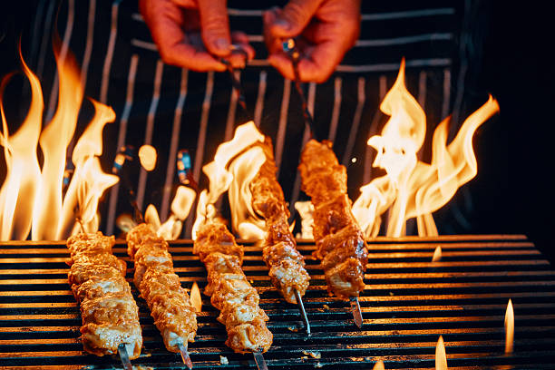 istock Chicken Skewers on BBQ Grill with Open Flames 2225110127