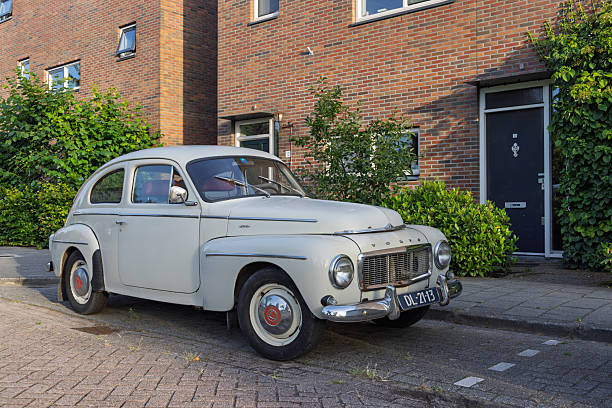 A well-preserved vintage Volvo PV544 car, a symbol of classic automotive design, parked on a quiet street in the Netherlands. Utrecht, Netherlands. 09 July 2025.
