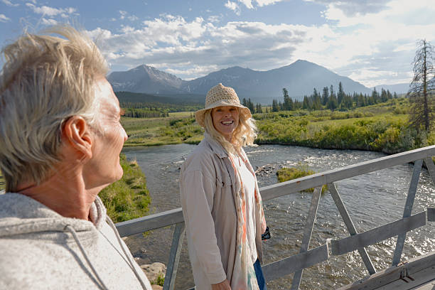istock Mature couple on bridge above river and wetlands 2225114090
