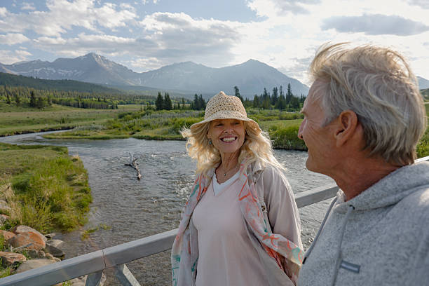 istock Mature couple on bridge above river and wetlands 2225114103