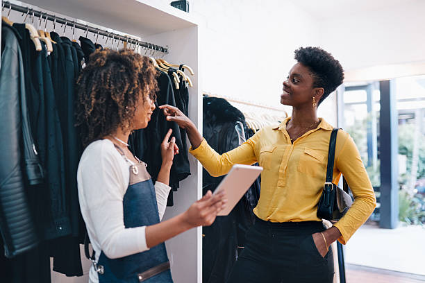 istock Woman assisting customer in a store 2225114316