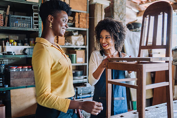 istock Professional assisting client in woodworking shop 2225114358