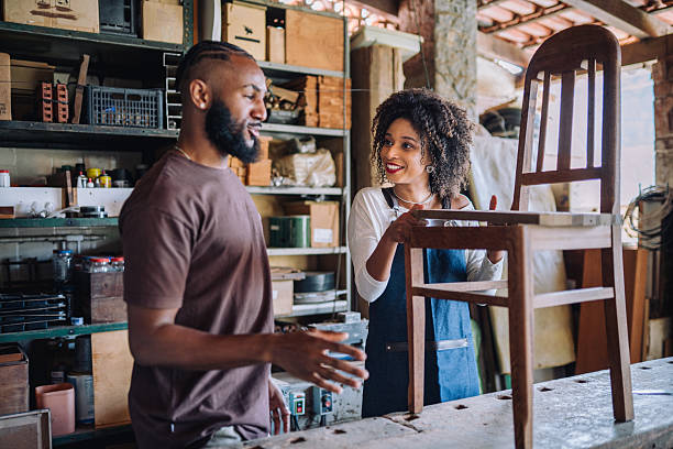 istock Professional assisting client in woodworking shop 2225114364