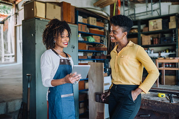 istock Professional assisting client in woodworking shop 2225114368