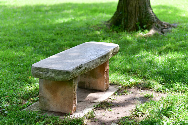 Old stone chairs that were damaged in the park.