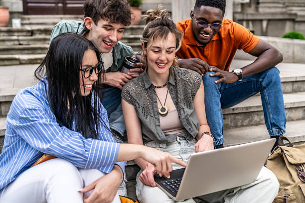 istock Students collaborating on laptop outdoors 2225122681