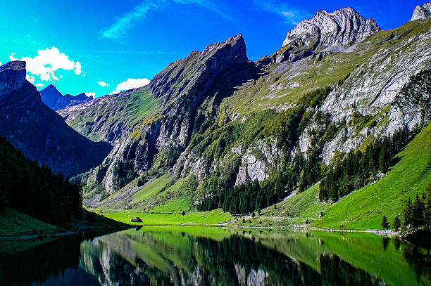 Misty lake in the swiss alps captured during summer season at an altitude of 1700m in the canton of glarus.
