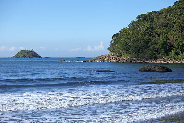 istock Blue sea water and white foam from waves breaking on shore 2225125067