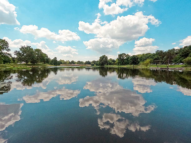 istock Summer Lake Scene with Clouds Reflecting on the Water 2225125353