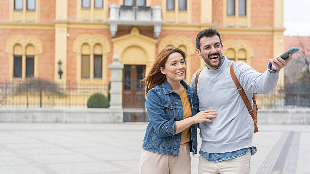 istock Engaged couple sharing a lively moment outdoors happily 2225133240