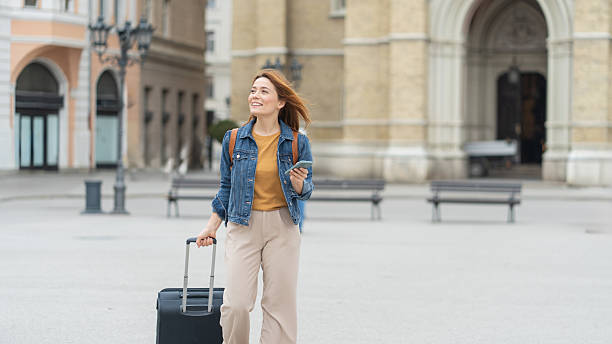 istock Happy traveler with suitcase navigating city streets smoothly 2225133256