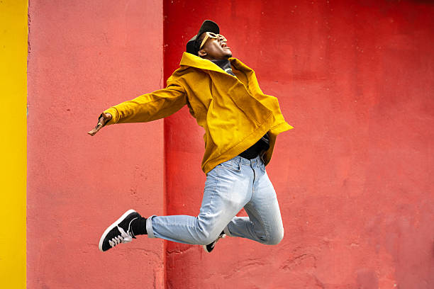 istock Good looking male hip hop dancer jumping and performing 2225134693