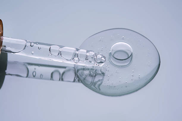 istock Pipette with serum on a blue background. Product texture. 2225136285