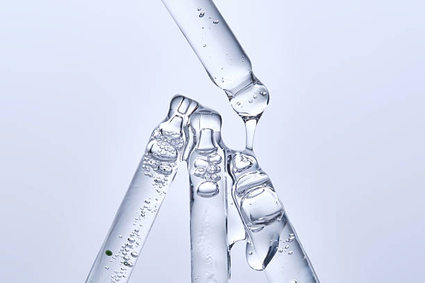 istock Four different face serum pipettes on a neutral background. 2225137290