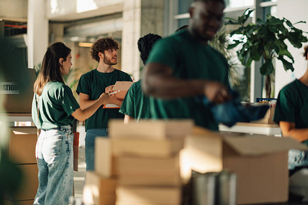 istock Volunteers preparing donation boxes at charity organization 2225137558