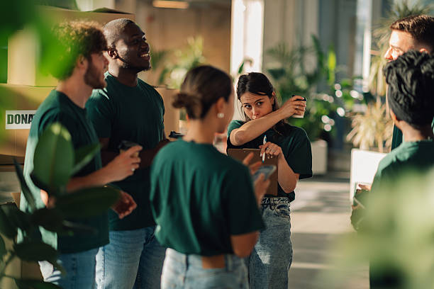 istock Volunteers discussing donation logistics in a warehouse 2225137587