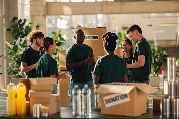 istock Volunteers preparing donation boxes at charity organization 2225137590