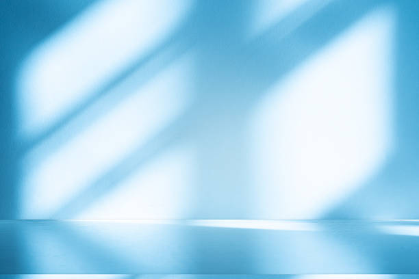 istock Studio style background wall decoration presentation uses white and blue tones. with shadows cast from a nearby window, concept creating a decorative 2225139827