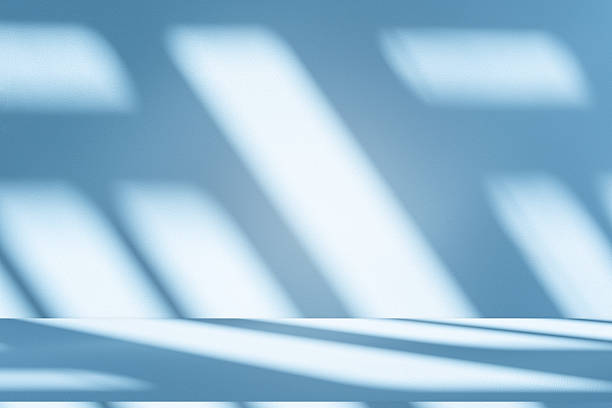 istock Studio style background wall decoration presentation uses white and blue tones. with shadows cast from a nearby window, concept creating a decorative 2225139863