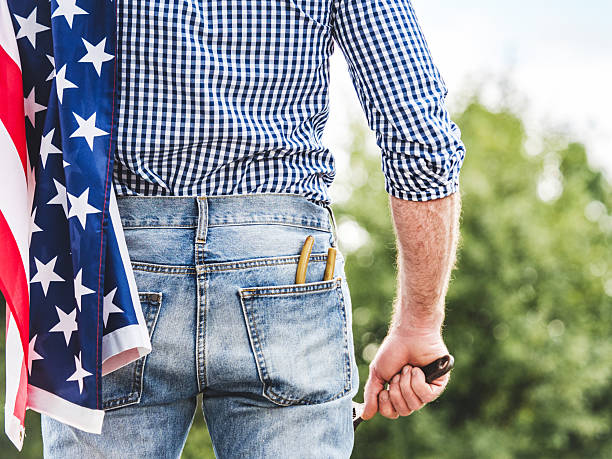 istock American flag, handsome man in work clothes 2225145839