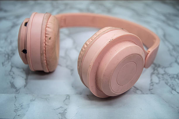 istock Pink over ear headphones with soft cushions placed on marble surface, highlighting clean design, fashion forward color, and audio lifestyle appeal for music or tech themes 2225146605