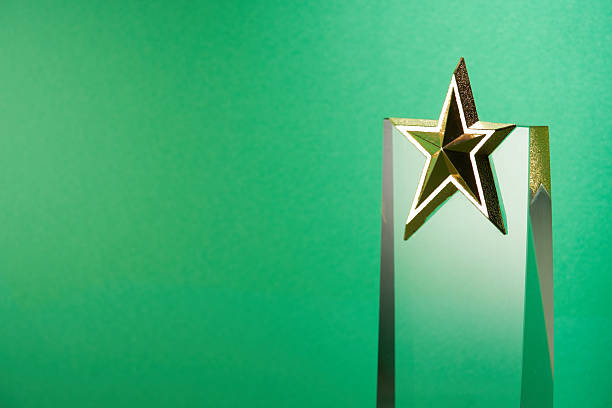 istock crystal trophy star shaped award against green background 2225147170