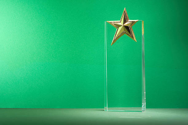 istock crystal trophy star shaped award against green background 2225147378