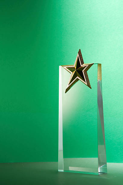 istock crystal trophy star shaped award against green background 2225147381