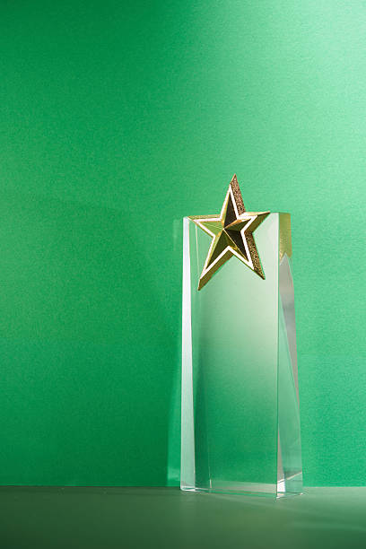 istock crystal trophy star shaped award against green background 2225147388