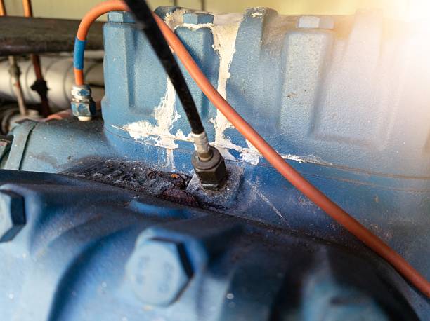 istock Compressor block with hose fitting for pressure measurement gauge. 2225147587