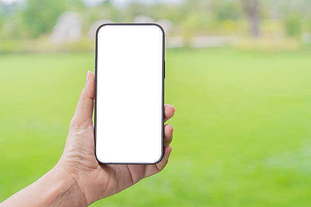 istock Mockup image of a woman holding and using mobile phone with isolated blank 2225148243