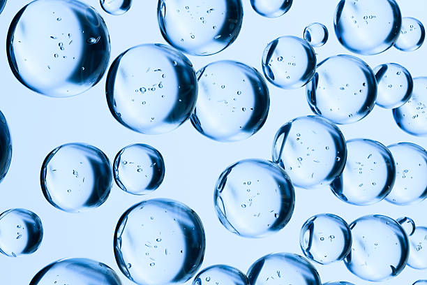 istock Transparent blue water bubbles floating on a light background. Abstract 3D render symbolizing hydration, freshness, purity, and skincare. Clean minimal concept for cosmetic or science themes. 2225152022
