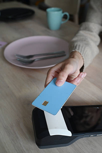 istock Using a contactless PDQ terminal to make a card payment 2225152346