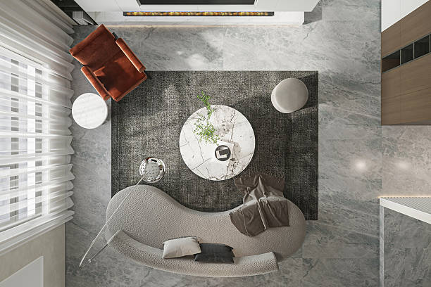 istock Aerial View -Elegant Living Room with Curved Sofa, Marble Table, and Fireplace 2225153055